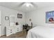 Bedroom featuring a bed, dresser, workspace, and plush carpet at 3322 Woodsfield Ne Dr, Marietta, GA 30062