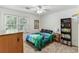 Comfortable bedroom with a bed, bookshelf, window, and plush carpet at 3322 Woodsfield Ne Dr, Marietta, GA 30062