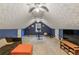 Large bonus room with plush carpet, comfortable sofa and access to additional closet space at 3322 Woodsfield Ne Dr, Marietta, GA 30062