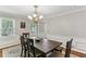 Light and airy dining room with wood table, decor and hardwood floors at 3322 Woodsfield Ne Dr, Marietta, GA 30062