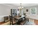 Light and airy dining room with wood table, decor and hardwood floors at 3322 Woodsfield Ne Dr, Marietta, GA 30062