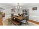 Light and airy dining room with wood table, decor and hardwood floors at 3322 Woodsfield Ne Dr, Marietta, GA 30062