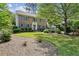Charming two-story brick home with blue shutters and a well-manicured front yard at 3322 Woodsfield Ne Dr, Marietta, GA 30062