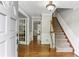 Welcoming foyer with hardwood floors, a staircase, and access to various rooms at 3322 Woodsfield Ne Dr, Marietta, GA 30062