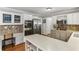 Bright kitchen with stainless steel appliances, island with countertop, and ample cabinet space at 3322 Woodsfield Ne Dr, Marietta, GA 30062