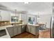 Modern kitchen with stainless steel appliances and white cabinets, offering ample storage space at 3322 Woodsfield Ne Dr, Marietta, GA 30062