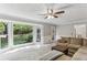 Inviting living room with large window, comfortable sofa, and neutral walls at 3322 Woodsfield Ne Dr, Marietta, GA 30062
