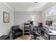 Well-lit office with dark-colored desk and chair and plenty of natural light at 3322 Woodsfield Ne Dr, Marietta, GA 30062