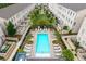 Aerial view of the community pool surrounded by residential buildings and manicured landscaping at 3433 Landen Pine Ne Ct, Atlanta, GA 30305