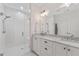 Bathroom featuring double vanity with marble countertops and frameless glass shower at 3433 Landen Pine Ne Ct, Atlanta, GA 30305