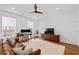 Bright living space with a comfortable sofa, home office setup, and modern entertainment unit at 3433 Landen Pine Ne Ct, Atlanta, GA 30305