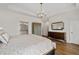 Another view of spacious main bedroom boasts hardwood floors, tray ceiling and modern lighting at 3433 Landen Pine Ne Ct, Atlanta, GA 30305