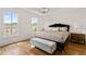 Spacious main bedroom boasts hardwood floors, tray ceiling and large windows for natural light at 3433 Landen Pine Ne Ct, Atlanta, GA 30305