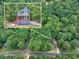 Bird's-eye perspective of a serene home nestled amid dense trees in a peaceful neighborhood at 1310 Ridgeview Rd, Auburn, GA 30011