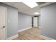 Finished basement hallway with laminate flooring and fresh paint at 1310 Ridgeview Rd, Auburn, GA 30011