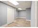 Finished basement area with laminate flooring and a closet at 1310 Ridgeview Rd, Auburn, GA 30011