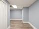 Finished basement with laminate flooring, neutral paint, and white trim at 1310 Ridgeview Rd, Auburn, GA 30011