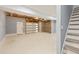Unfinished basement area with garage door and concrete floor at 1310 Ridgeview Rd, Auburn, GA 30011