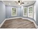 Bedroom featuring hardwood floors, a ceiling fan, and a bay window at 1310 Ridgeview Rd, Auburn, GA 30011