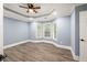 Bedroom with tray ceiling, hardwood floors, and recessed lights at 1310 Ridgeview Rd, Auburn, GA 30011