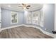 Spacious bedroom filled with natural light highlighting hardwood floors and crown molding at 1310 Ridgeview Rd, Auburn, GA 30011