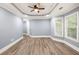 Spacious bedroom featuring trey ceilings, recessed lighting, and beautiful hardwood flooring at 1310 Ridgeview Rd, Auburn, GA 30011