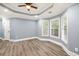 Spacious bedroom featuring trey ceilings, recessed lighting, and beautiful hardwood flooring at 1310 Ridgeview Rd, Auburn, GA 30011