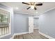 Well-lit bedroom featuring hardwood floors and a walk-in closet at 1310 Ridgeview Rd, Auburn, GA 30011