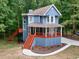 Exterior view of a blue house with wood trim and a spacious porch at 1310 Ridgeview Rd, Auburn, GA 30011