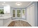 Bright eat-in kitchen featuring granite countertops, bay windows, and natural light at 1310 Ridgeview Rd, Auburn, GA 30011