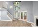 Spacious living room with high ceilings, a wall of windows, and an open layout at 1310 Ridgeview Rd, Auburn, GA 30011