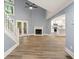 Bright and airy living room featuring soaring ceilings, a fireplace, and an open layout into a modern kitchen at 1310 Ridgeview Rd, Auburn, GA 30011