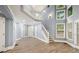 Bright living room with tall ceilings, large windows, and wood flooring throughout at 1310 Ridgeview Rd, Auburn, GA 30011