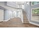 Spacious living room showcasing elegant trim, generous windows, and seamless access to adjacent rooms at 1310 Ridgeview Rd, Auburn, GA 30011
