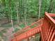 Wood staircase showcasing quality craftsmanship and design, nestled in a lush, green wooded area at 1310 Ridgeview Rd, Auburn, GA 30011