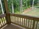 Wooden deck overlooking the backyard with trees and grass at 4050 Sierra Vista Cirs, Cumming, GA 30040