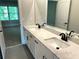 Elegant bathroom with a dual-sink vanity, quartz countertops, and modern black fixtures at 4050 Sierra Vista Cirs, Cumming, GA 30040