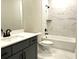 Modern bathroom featuring marble-look tile, gray vanity, and sleek black fixtures, offering a spa-like experience at 4050 Sierra Vista Cirs, Cumming, GA 30040