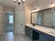 Bright bathroom with dual sink vanity, white countertops, and decorative lighting fixtures at 4050 Sierra Vista Cirs, Cumming, GA 30040