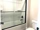 Clean bathroom with a tub, sliding glass shower doors, and modern fixtures at 4050 Sierra Vista Cirs, Cumming, GA 30040