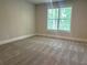 Cozy bedroom with plush carpeting, neutral walls, and ample natural light, perfect for relaxation at 4050 Sierra Vista Cirs, Cumming, GA 30040