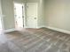 Spacious bedroom showcasing neutral walls, and an adjoining doorway leading to another room at 4050 Sierra Vista Cirs, Cumming, GA 30040