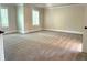 Spacious main bedroom with large windows and carpet floors at 4050 Sierra Vista Cirs, Cumming, GA 30040