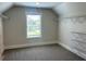 Spacious walk-in closet with window and installed shelving for organized storage at 4050 Sierra Vista Cirs, Cumming, GA 30040