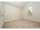 Bedroom with neutral carpet and a window providing natural light at 4438 Tuckahoe Ct, Douglasville, GA 30135