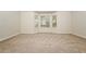 Neutral bedroom with bay window, neutral walls, and carpet at 4438 Tuckahoe Ct, Douglasville, GA 30135