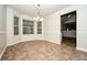Sunny dining area featuring tile flooring, neutral paint and chair rail at 4438 Tuckahoe Ct, Douglasville, GA 30135