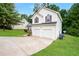 Charming two-story home featuring a two-car garage, well-maintained lawn, and classic curb appeal at 4438 Tuckahoe Ct, Douglasville, GA 30135