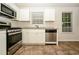 Well-equipped kitchen with stainless steel appliances, granite countertops, and tile floors at 4438 Tuckahoe Ct, Douglasville, GA 30135
