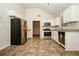Spacious kitchen featuring stainless steel appliances, granite countertops, and tile flooring at 4438 Tuckahoe Ct, Douglasville, GA 30135